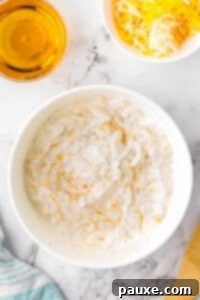 Ultimate Beer Cheese Dip 10 A white bowl containing the freshly mixed creamy beer dip, smooth and ready to be chilled.