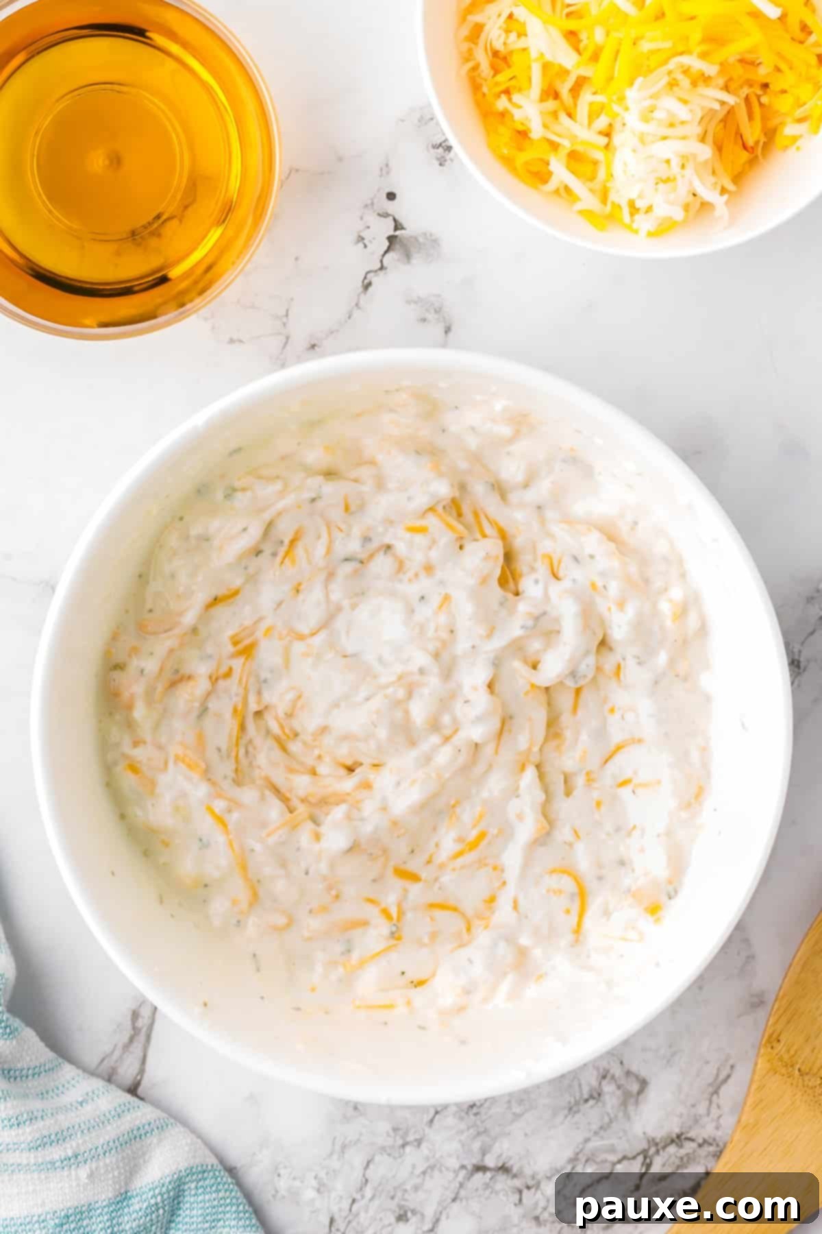 Ultimate Beer Cheese Dip 5 A white bowl with the creamy beer dip, perfectly blended and smooth, ready for chilling or heating.