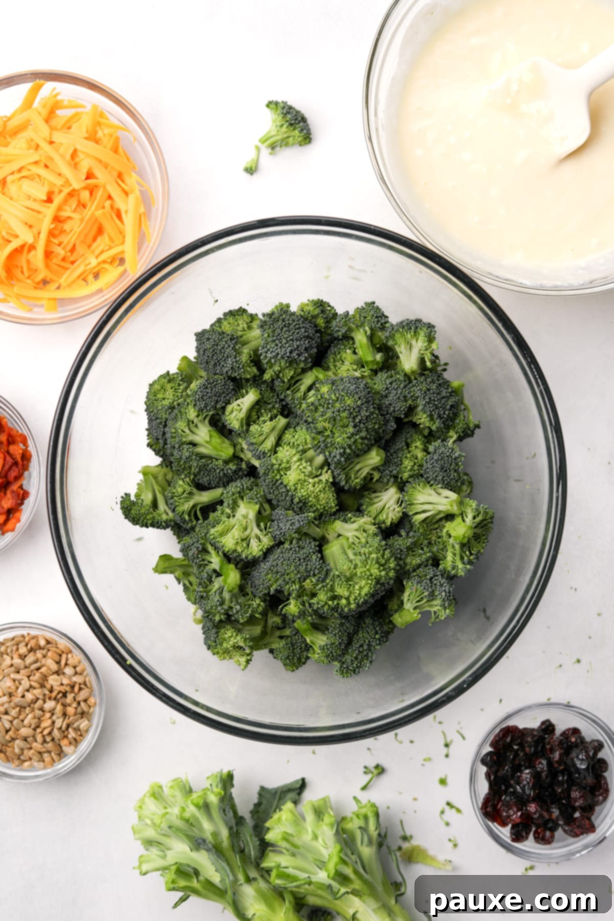 Creamy Crunch Broccoli Salad 6 A large bowl filled with perfectly cut, bite-sized broccoli florets, ready for the dressing.