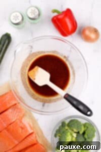 A large bowl with olive oil and seasonings mixed together.