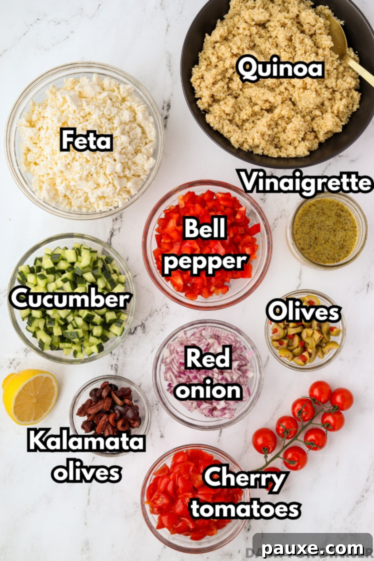 Zesty Mediterranean Quinoa Salad 3 A beautiful flat lay of fresh ingredients for Greek Quinoa Salad, including vibrant cucumbers, colorful bell peppers, pungent red onion, and an assortment of olives.