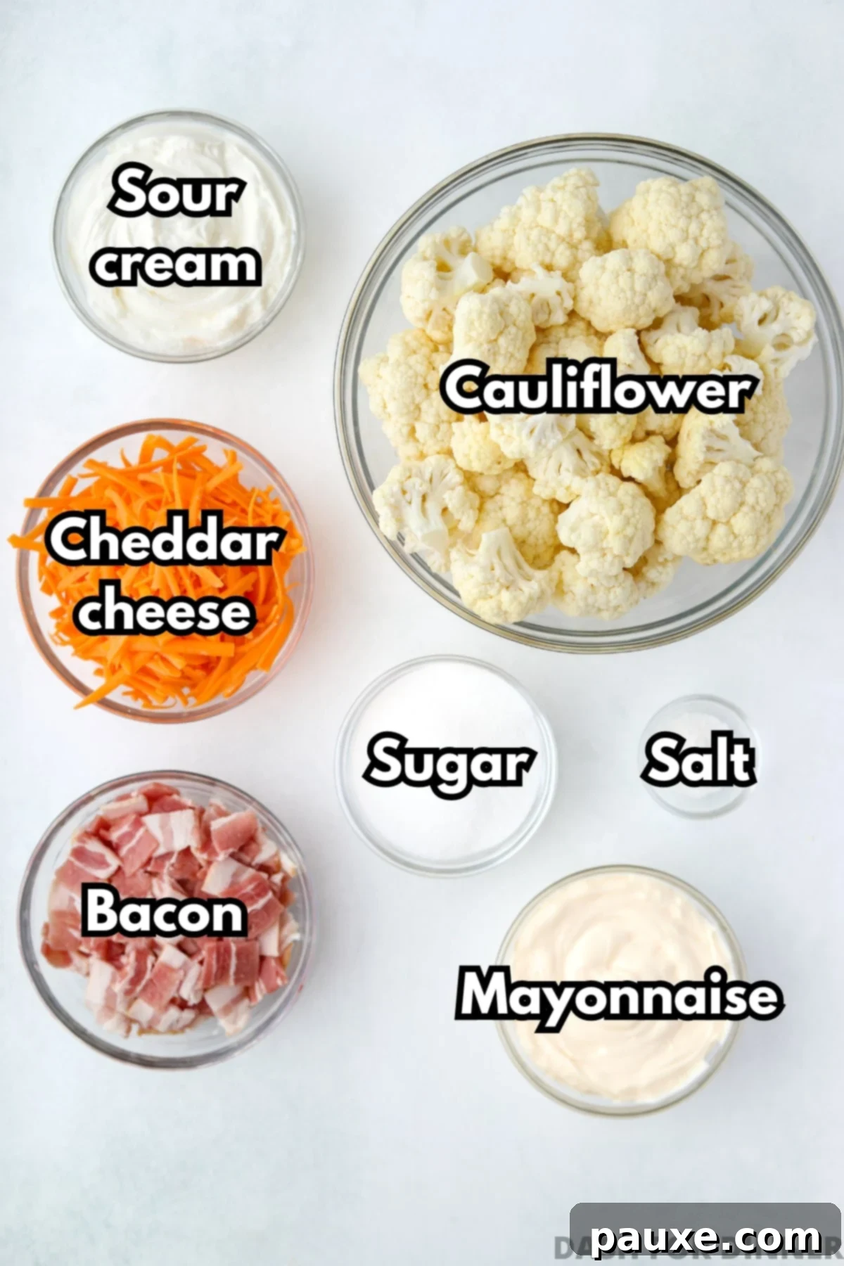 Spiced Cauliflower Salad with Tahini 3 The ingredients needed to make cauliflower salad: cheese, sour cream, mayonnaise, bacon, and cauliflower florets.