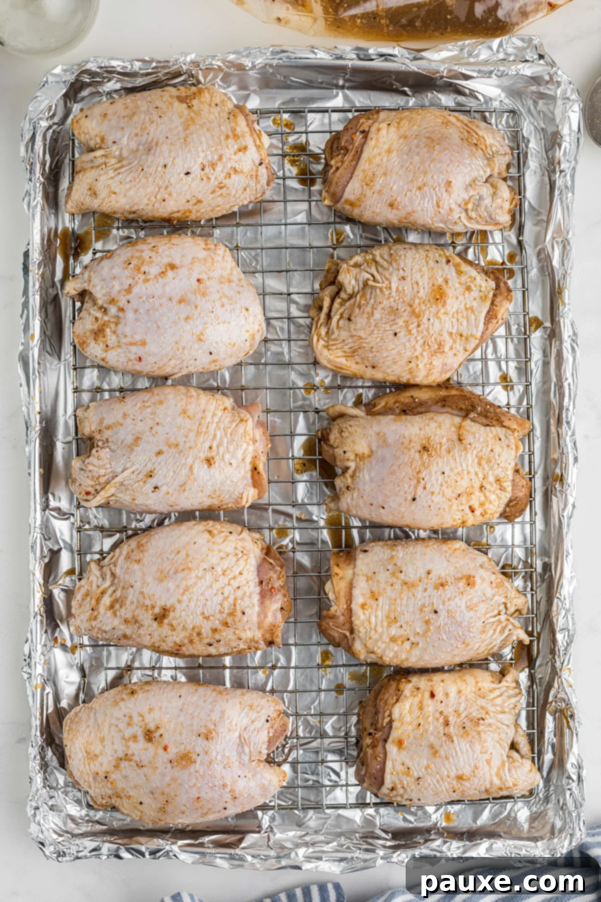 Mastering Chicken Marinades 6 Chicken thighs on a wire baking rack.
