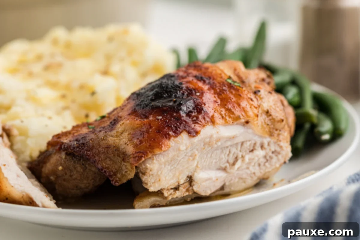 Mastering Chicken Marinades 10 A close up of a chicken thigh served with mashed potato and green beans.