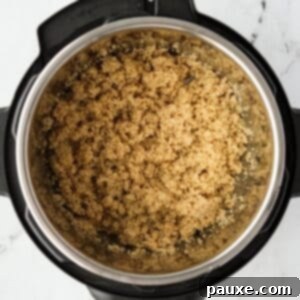 Effortless Instant Pot Quinoa 9 An Instant Pot with perfectly cooked quinoa in the insert, ready to serve.