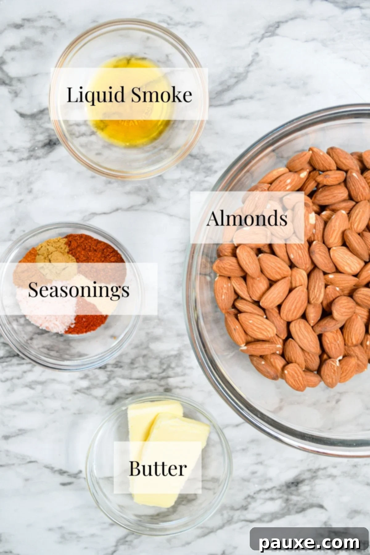 Crispy Golden Air Fryer Almonds 3 The ingredients needed to make roasted almonds: butter, almonds, liquid smoke, and butter.