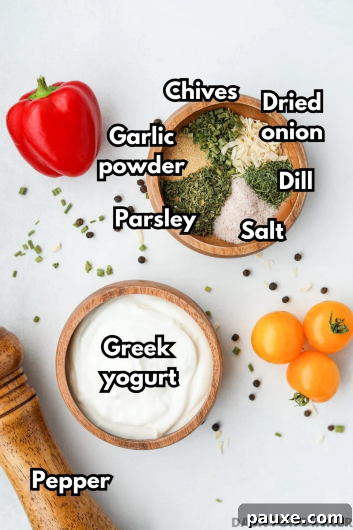 Healthy Greek Yogurt Ranch 3 A small bowl of greek yogurt, and another small bowl filled with various seasonings (chives, dill, parsley, salt, etc).