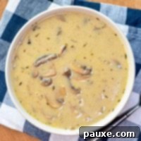Instant Pot Creamy Mushroom Comfort 11 A bowl of homemade mushroom soup on a blue check napkin