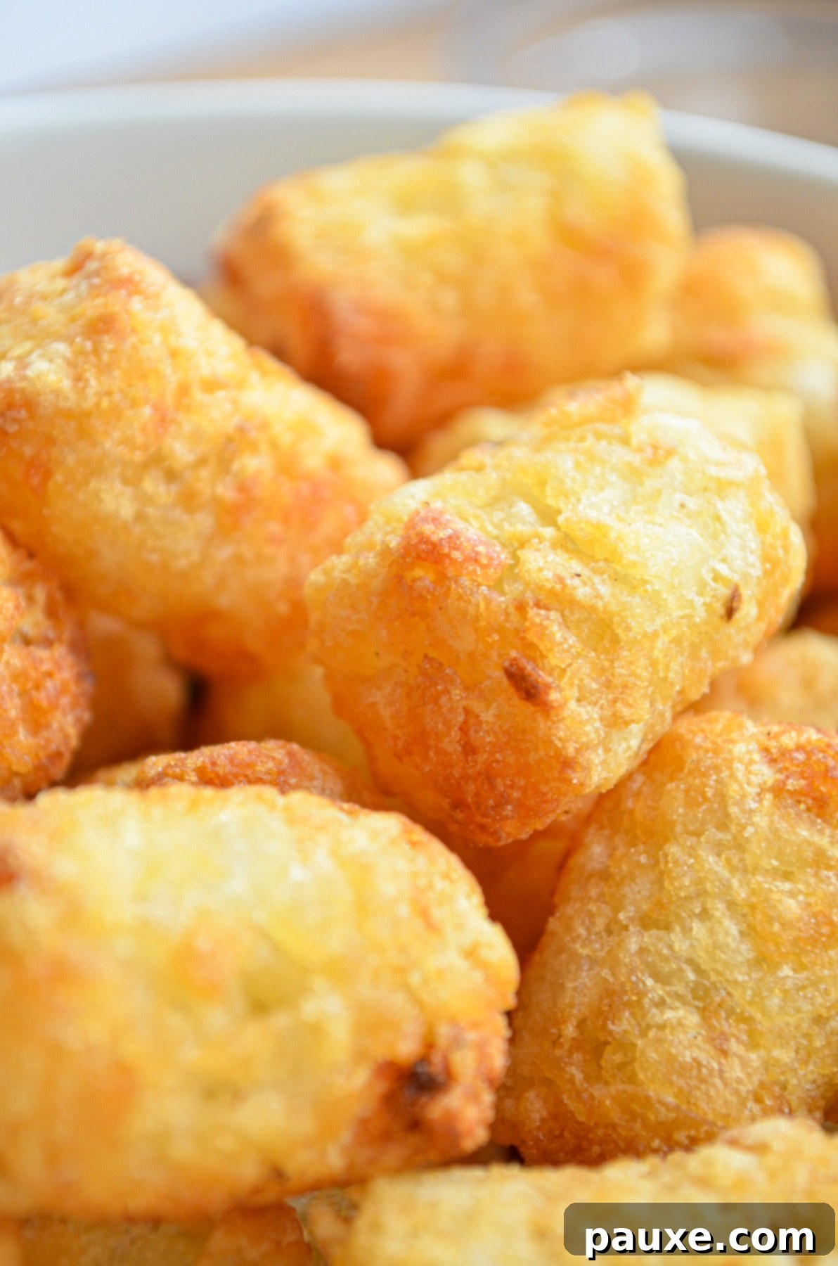 Crispy Air-Fried Tater Tots 3 A bowl of delicious, golden cooked tater tots, ready to be served.