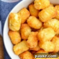 Crispy Air-Fried Tater Tots 8 A bowl of perfectly cooked and golden air fryer tater tots.