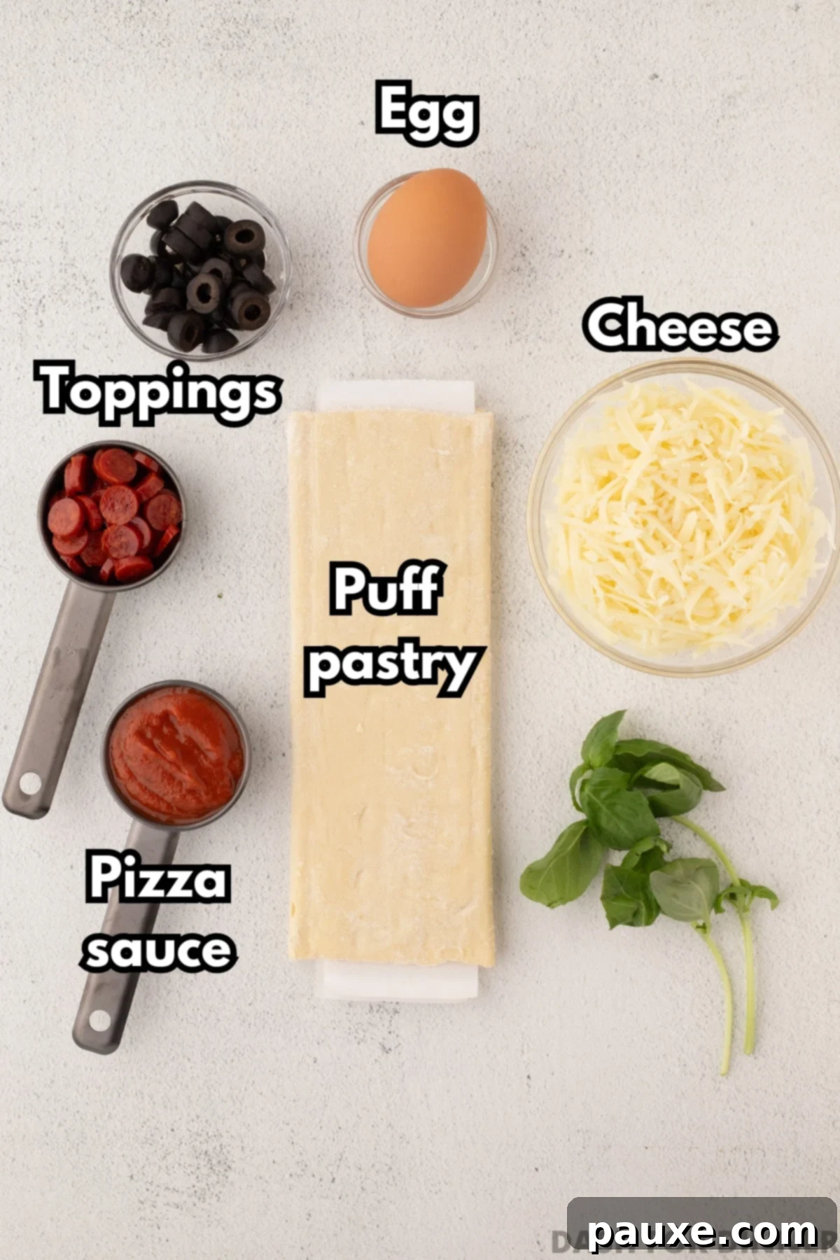 Crispy Puff Pizza 3 The ingredients needed to make pizza with puff pastry: sauce, puff pastry, cheese, toppings, egg, etc. laid out neatly.