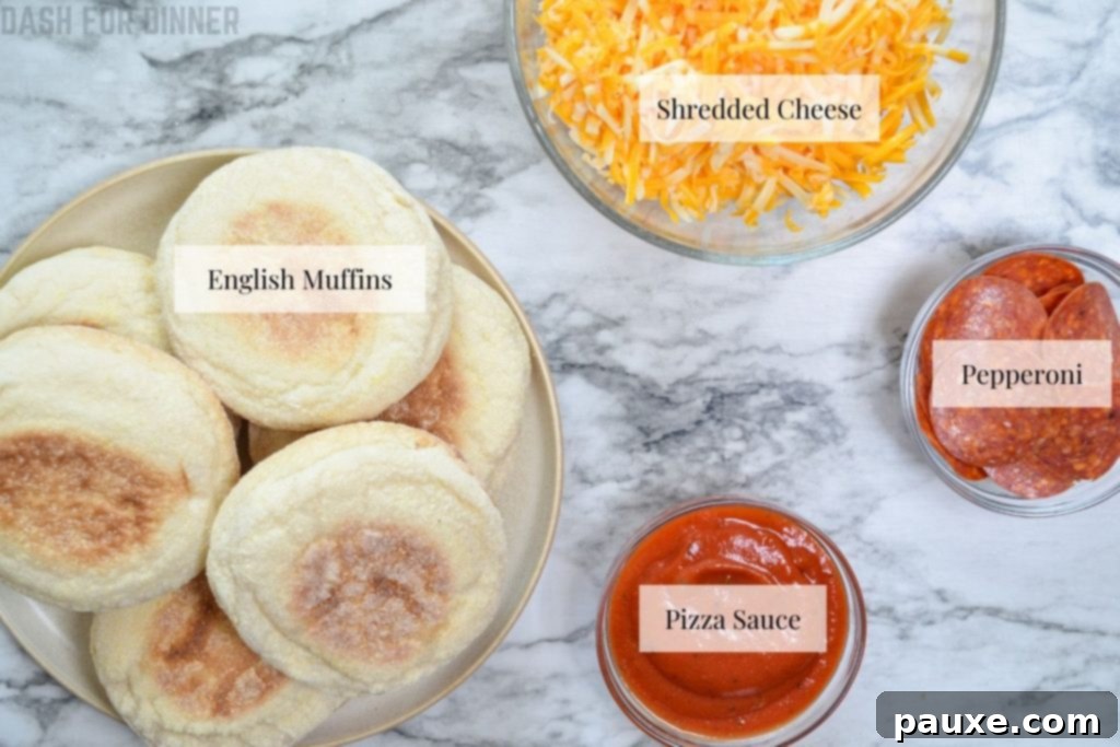 Quick Air Fryer Muffin Pizzas 4 The simple ingredients needed to make air fryer English muffin pizzas, laid out on a table.