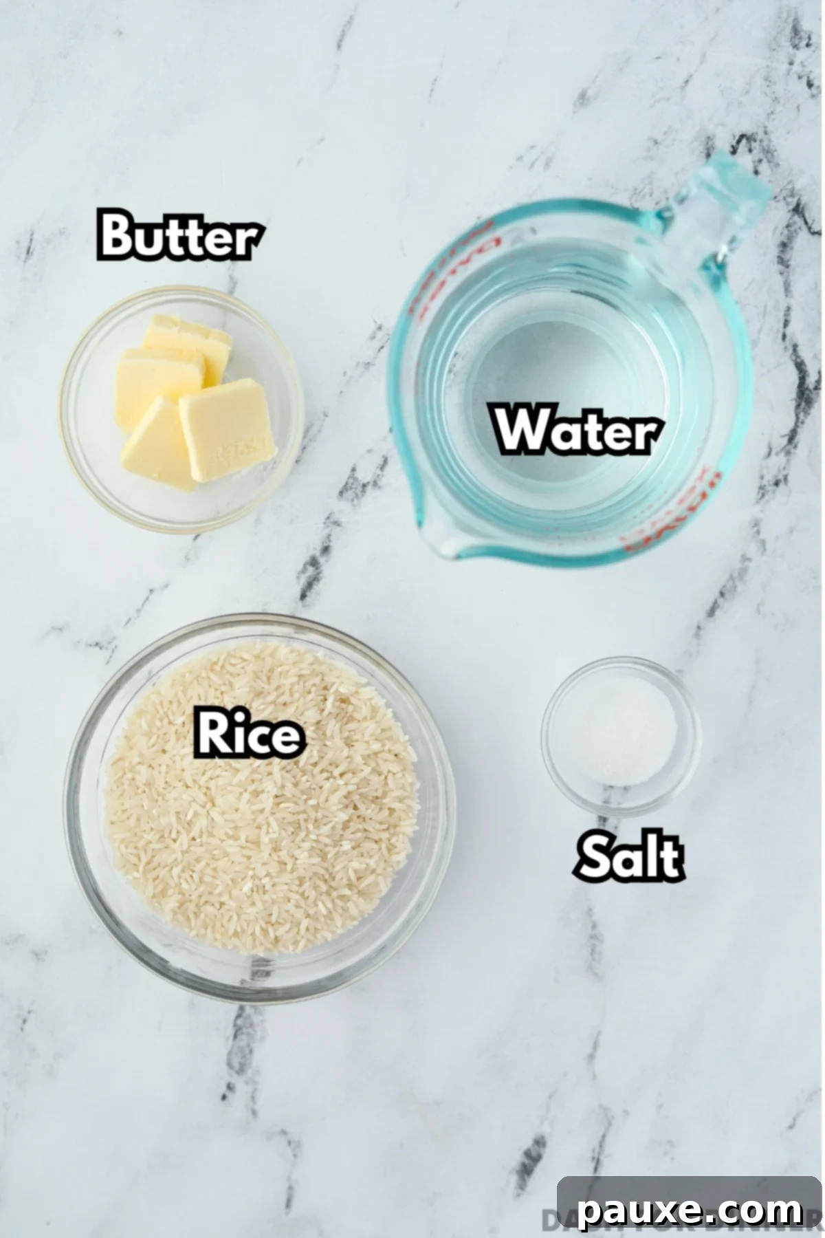 Golden Baked Rice 3 The simple ingredients needed to make oven baked rice: long-grain rice, boiling water, butter, and salt, neatly arranged.