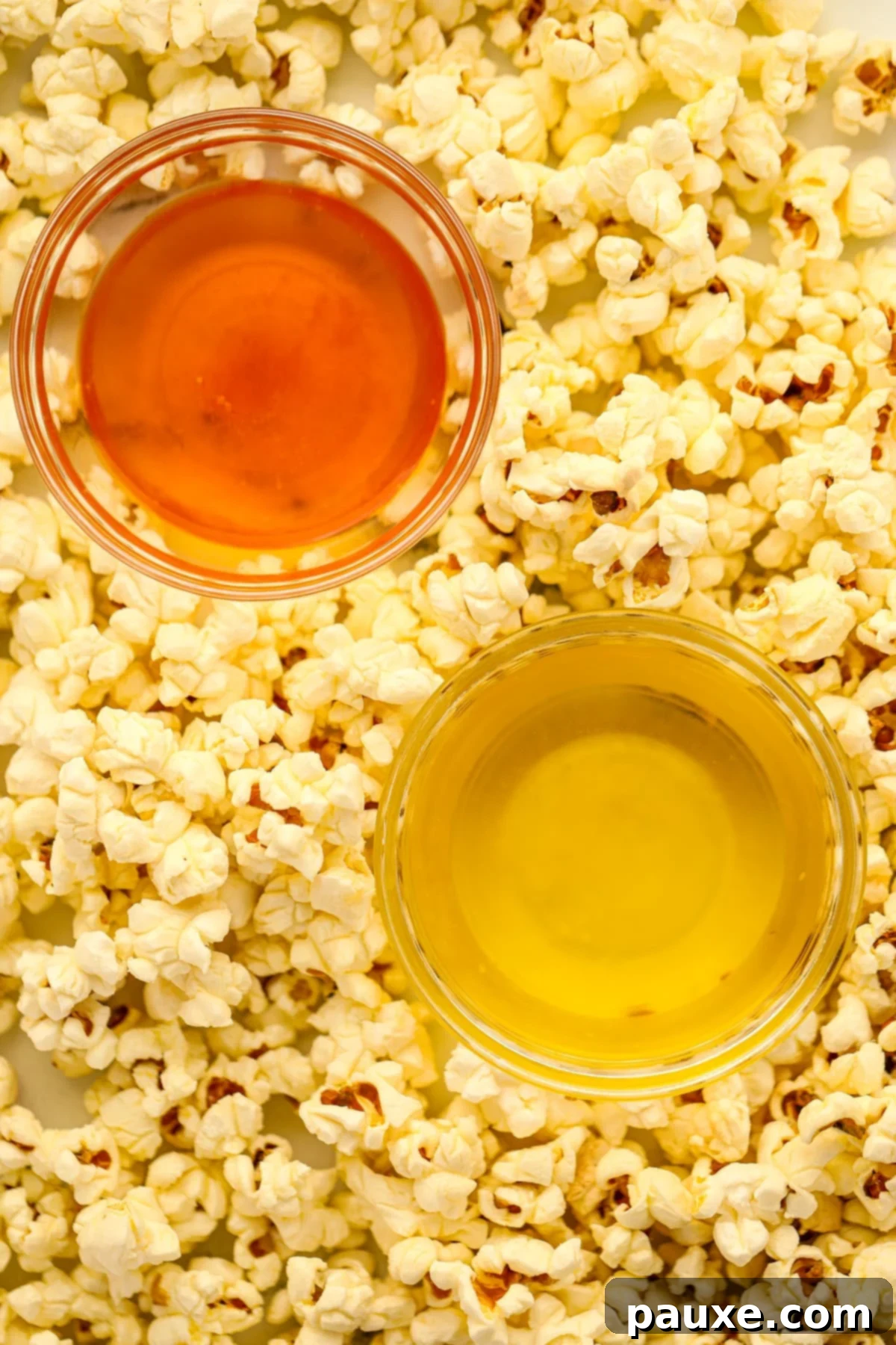 Golden Popcorn Topping 7 Two small bowls of clarified butter, one plain and one colored with annatto.