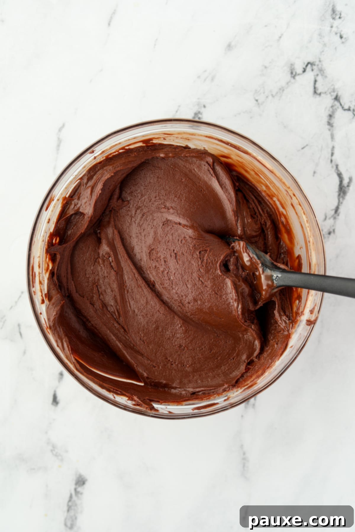 Refreshing Peppermint Truffles 6 A glass bowl filled with melted chocolate.