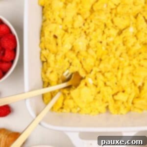 Fluffy Oven Scramble 8 A white baking dish filled with cooked scrambled eggs.