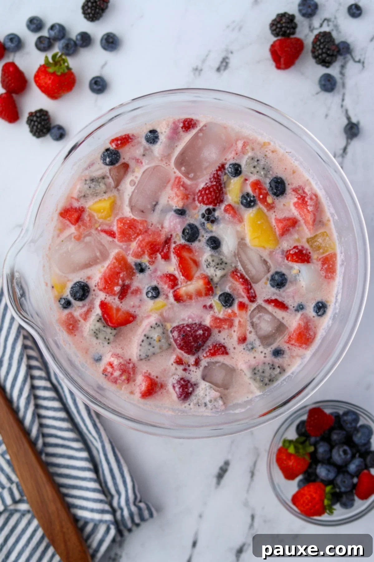 A large bowl of fruit punch in a milky liquid.