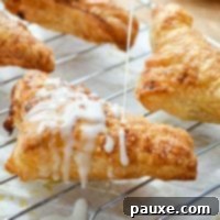 Golden Air Fried Apple Delights 11 A freshly baked apple turnover, beautifully glazed, prepared in an air fryer.