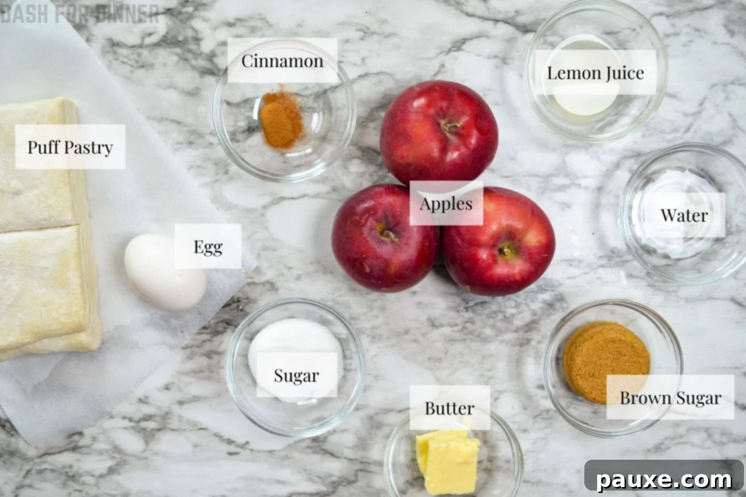 Golden Air Fried Apple Delights 4 A flat lay of all the essential ingredients required to make air fryer apple turnovers, including fresh apples, puff pastry, butter, and spices.