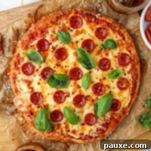 Wholesome Yogurt Pizza 11 A pizza on parchment paper, topped with pepperoni, cheese, and fresh basil, ready to be enjoyed.