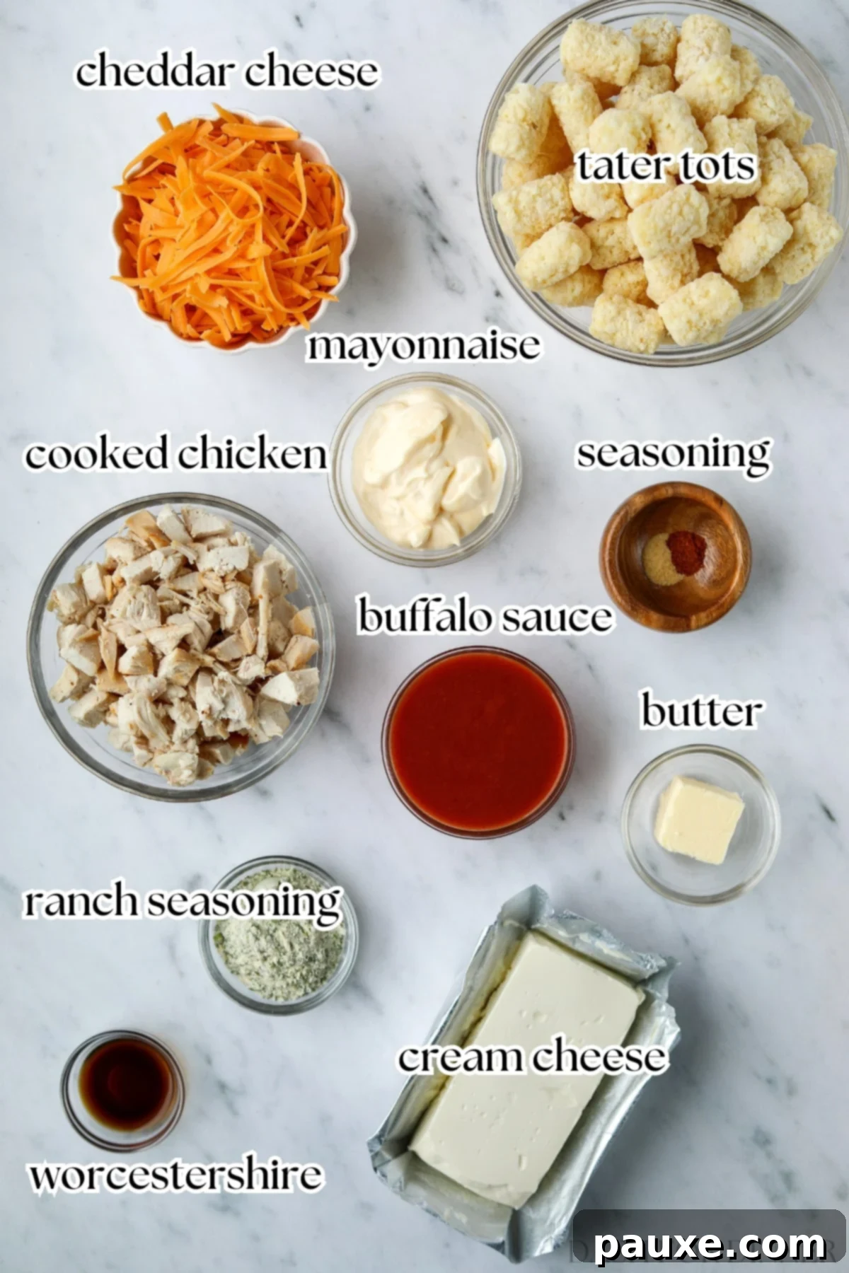 Fiery Buffalo Tot Bake 3 The ingredients needed to make buffalo chicken casserole, including cooked chicken, cheese, and cream cheese.