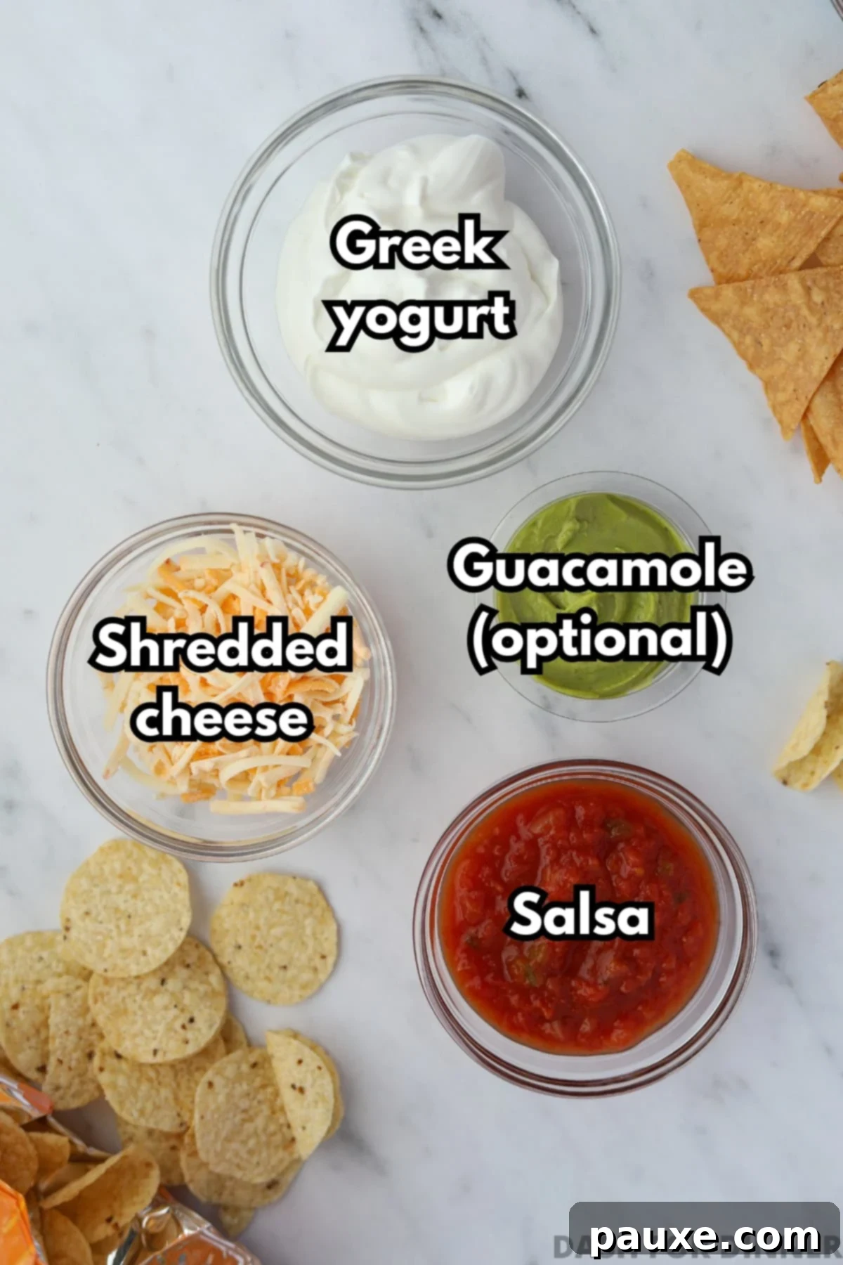 Power-Packed Greek Yogurt Dip 3 The ingredients needed to make layered protein dip: Greek yogurt, salsa, shredded cheese, and guacamole.