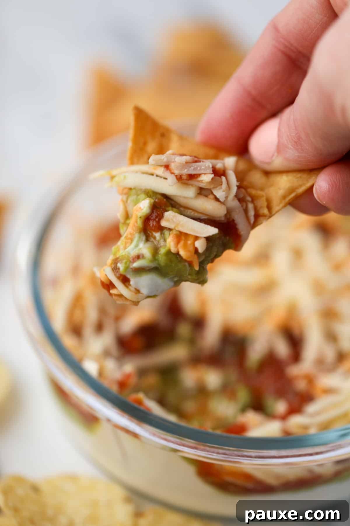 Power-Packed Greek Yogurt Dip 7 A tortilla chip with guacamole, salsa, shredded cheese, and Greek yogurt.