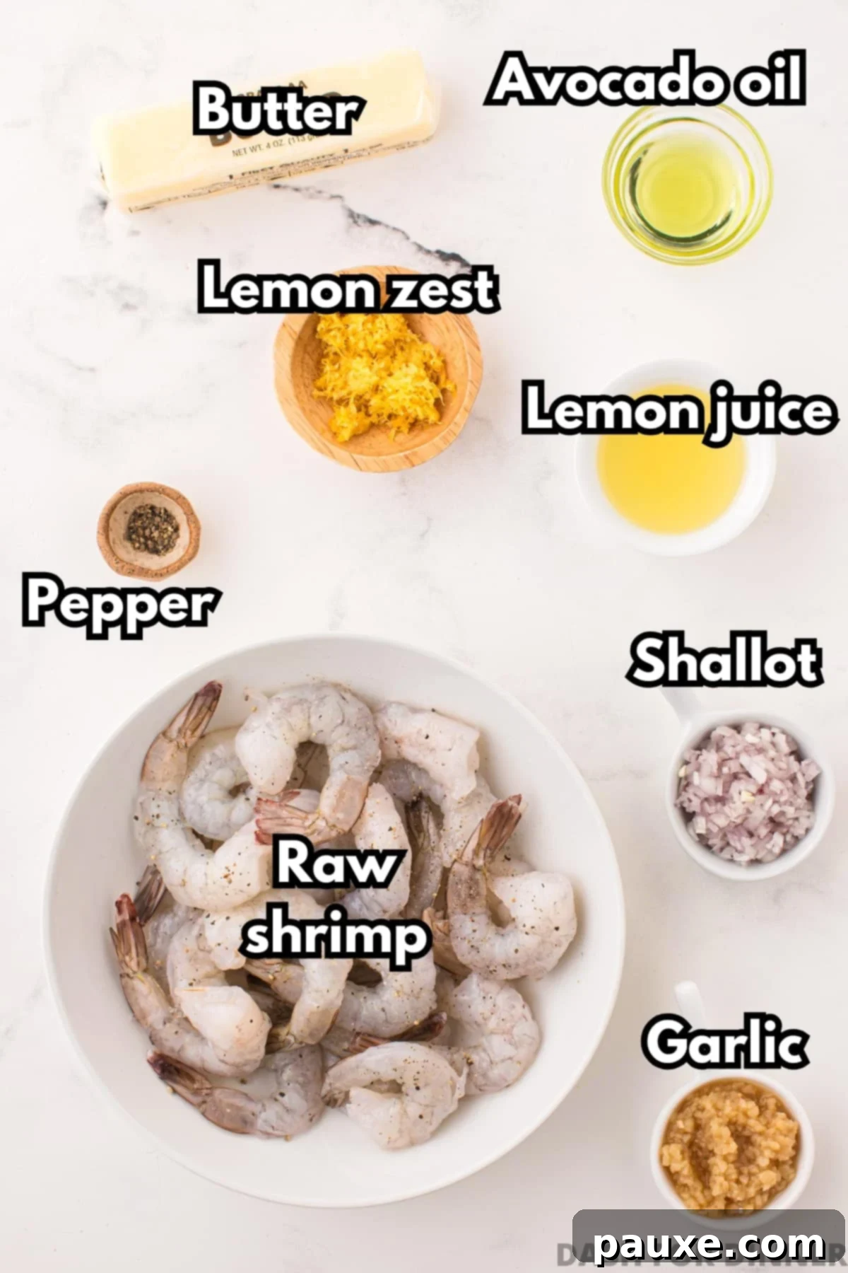 Zesty Lemon-Garlic Butter Shrimp 3 A neatly arranged display of fresh ingredients for lemon garlic butter shrimp, including a bowl of raw shrimp, minced garlic, lemon zest, and butter.