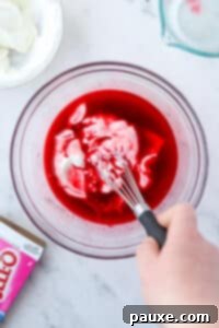 Creamy Greek Yogurt Delight 12 Whisking yogurt into liquid jello.