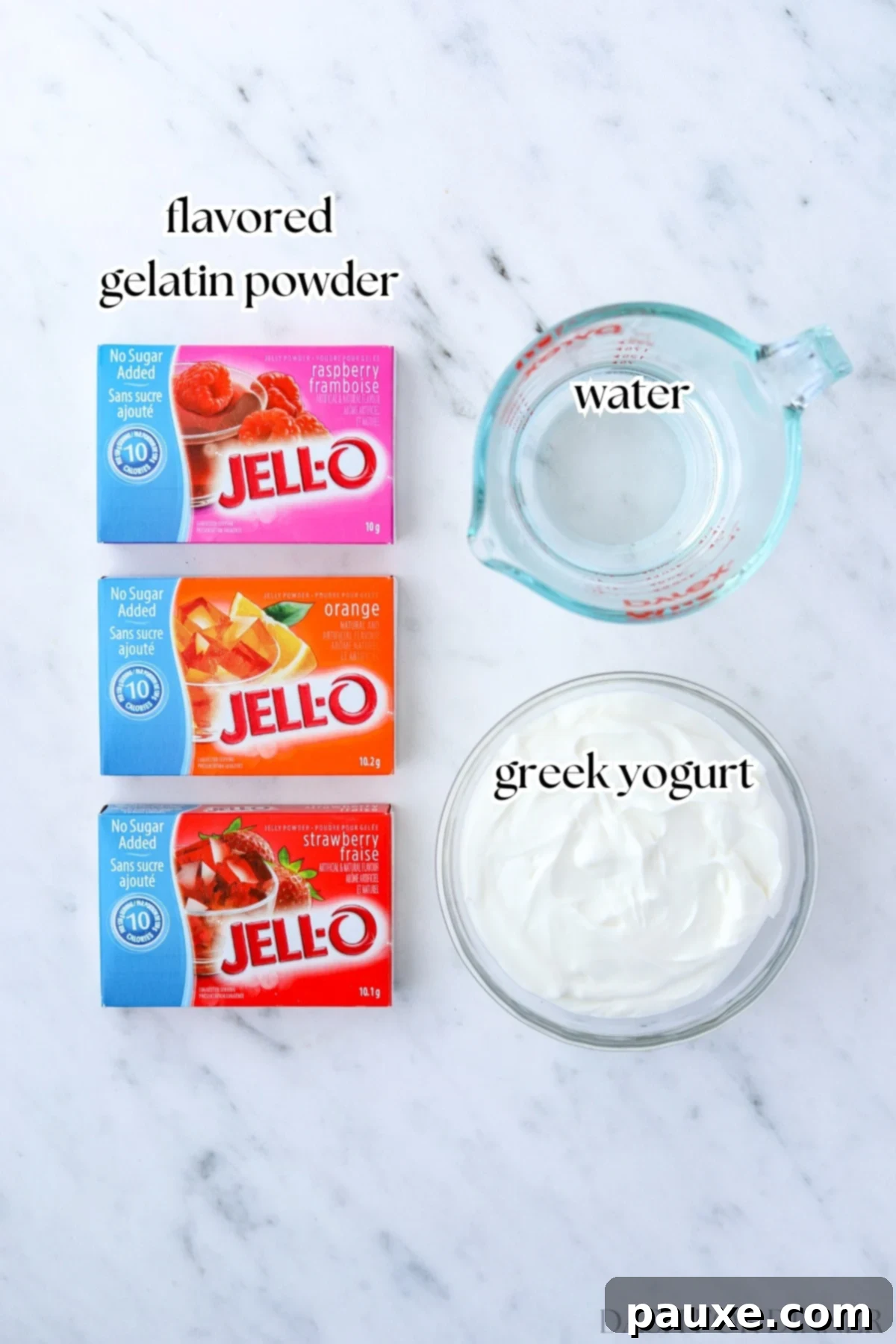 Creamy Greek Yogurt Delight 3 Several packages of jello, some water, and greek yogurt laid out on a table.