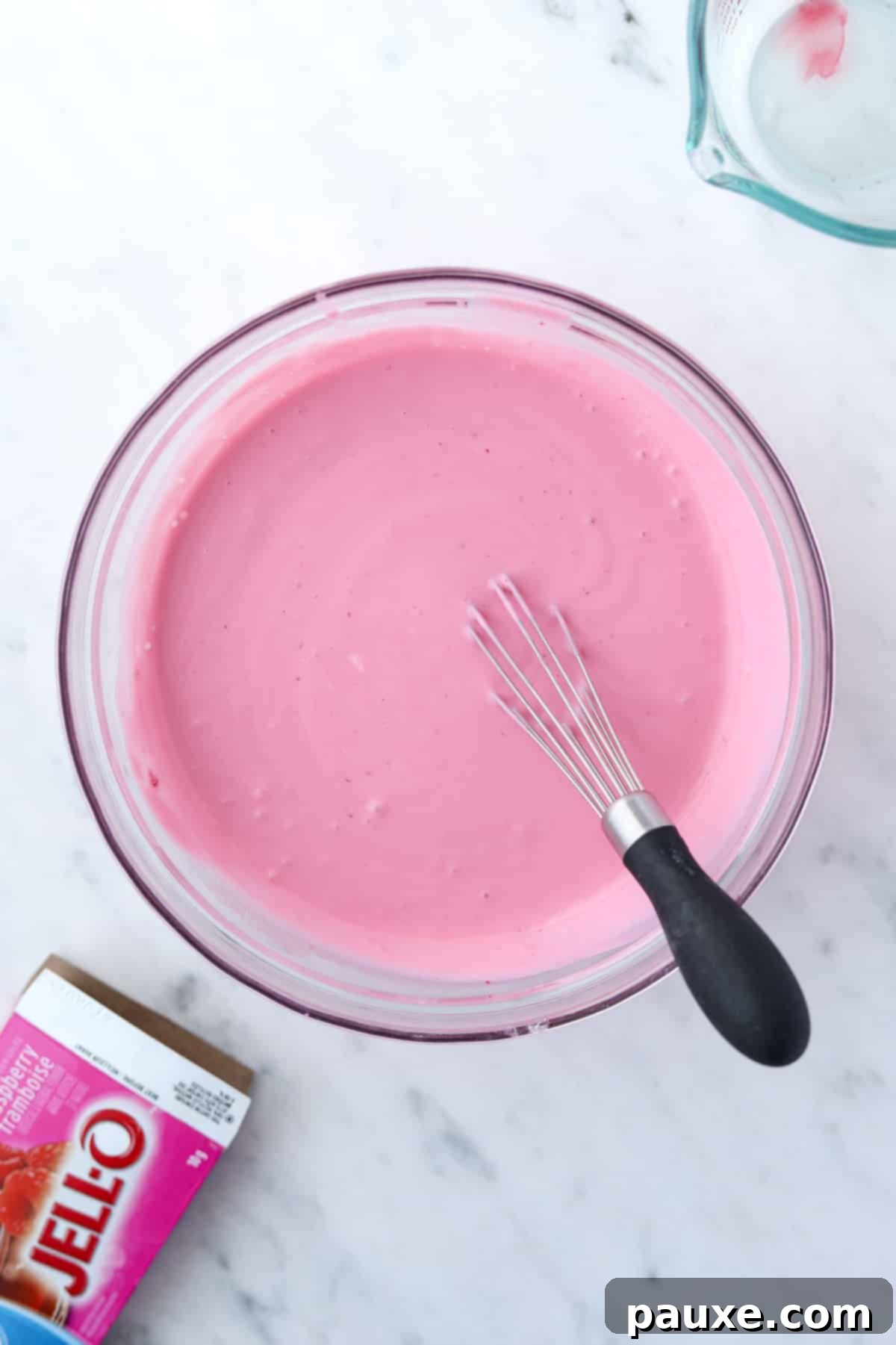 Creamy Greek Yogurt Delight 6 A bowl of greek yogurt mixed with raspberry jello.