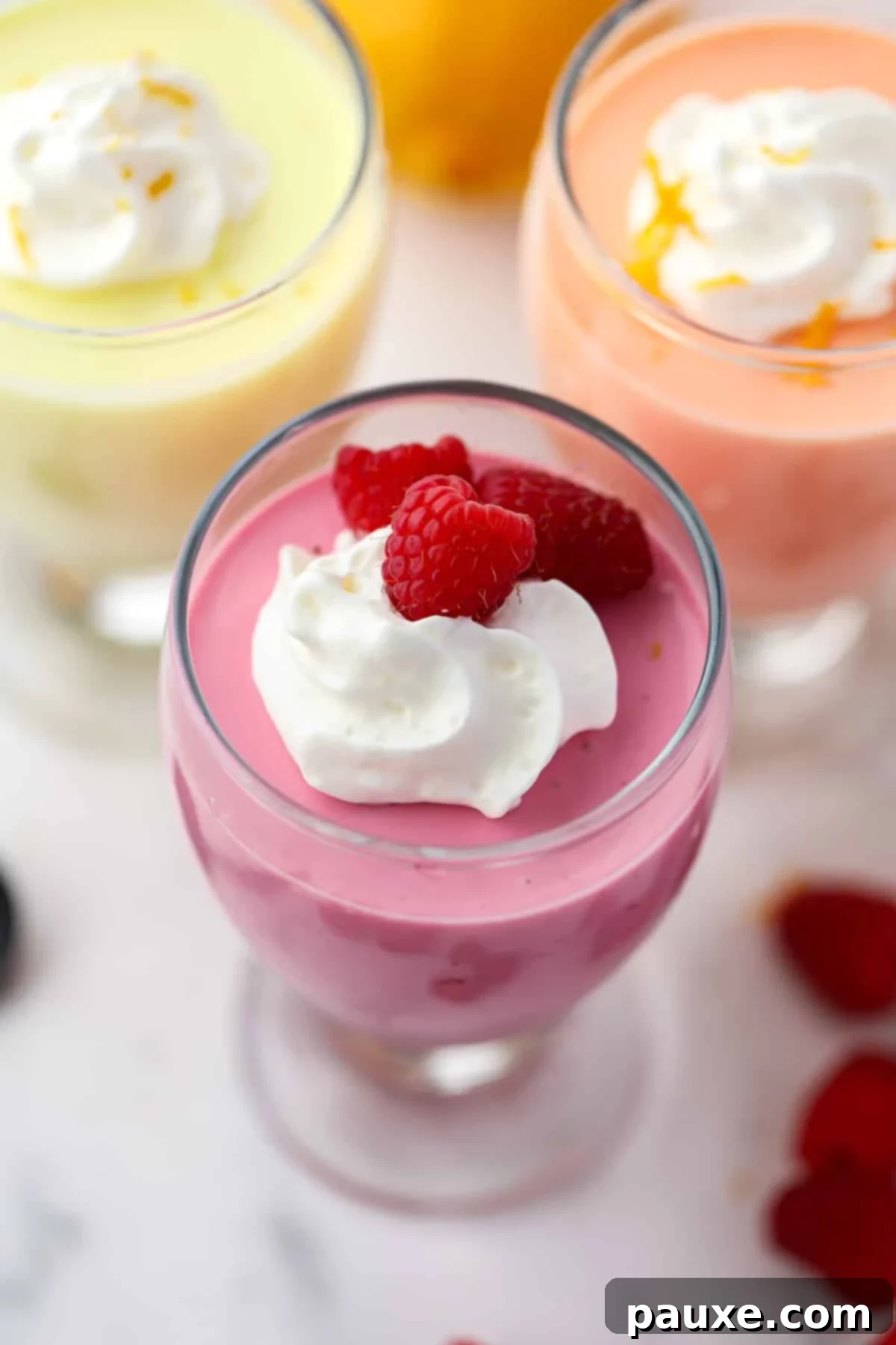 Creamy Greek Yogurt Delight 8 Parfait glasses filled with yogurt jello mousse.