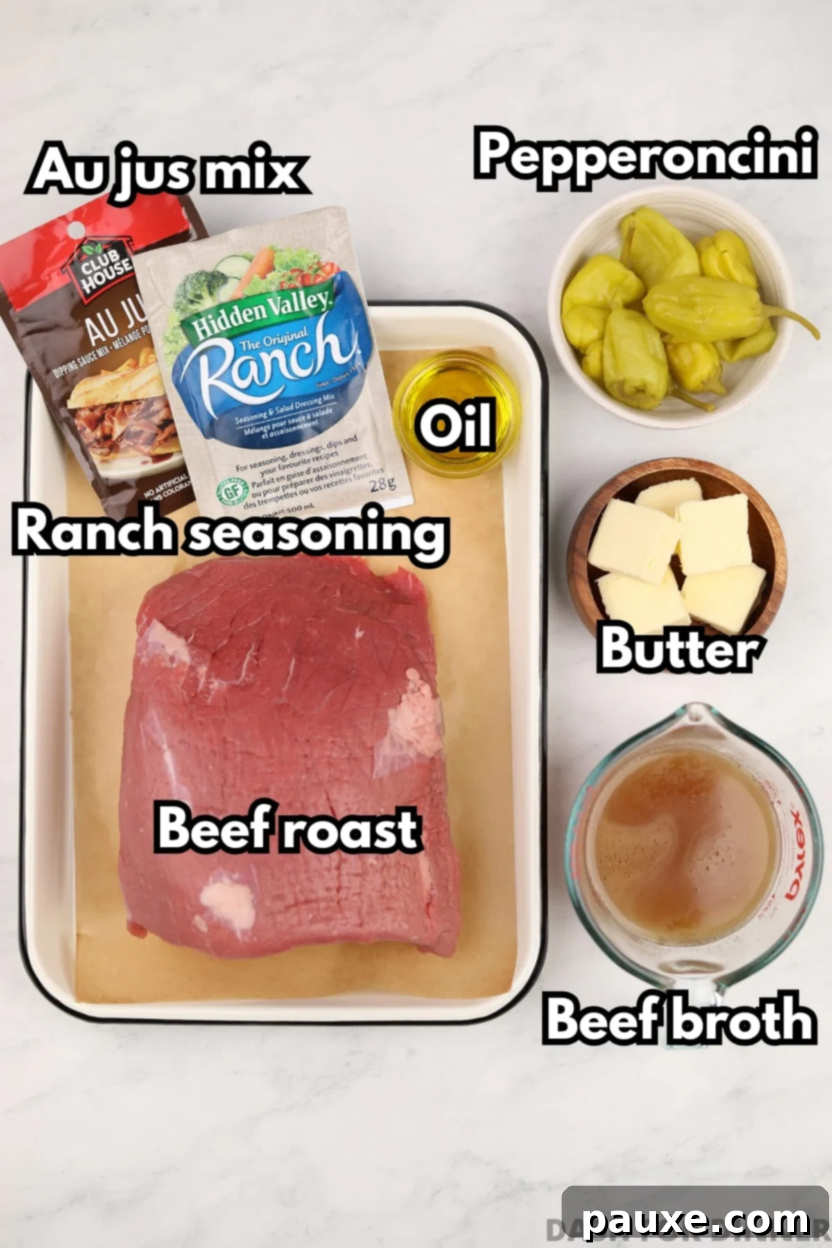 The ingredients needed to make Mississippi roast: beef roast, ranch mix, au jus mix, butter, pepperoncini peppers, and oil.