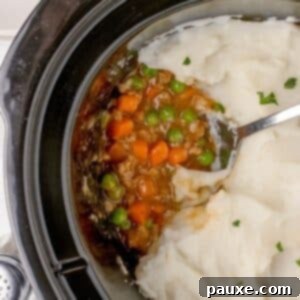 Set-It-And-Forget-It Shepherd's Pie 9 A slow cooker filled with shepherd's pie topped with mashed potatoes.