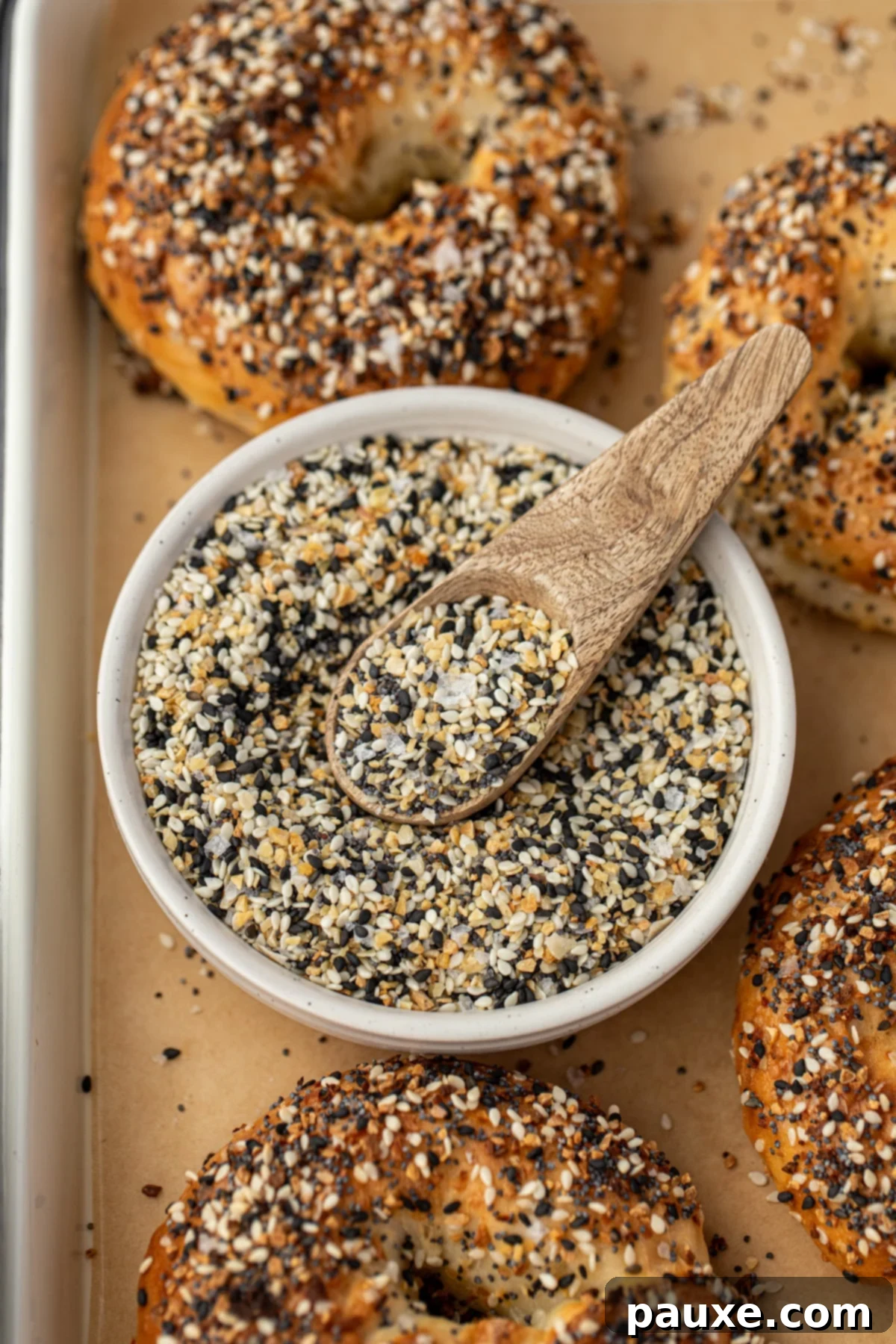 The Ultimate Seed & Spice Blend 2 A small bowl of everything but the bagel seasoning with a small wooden spoon.