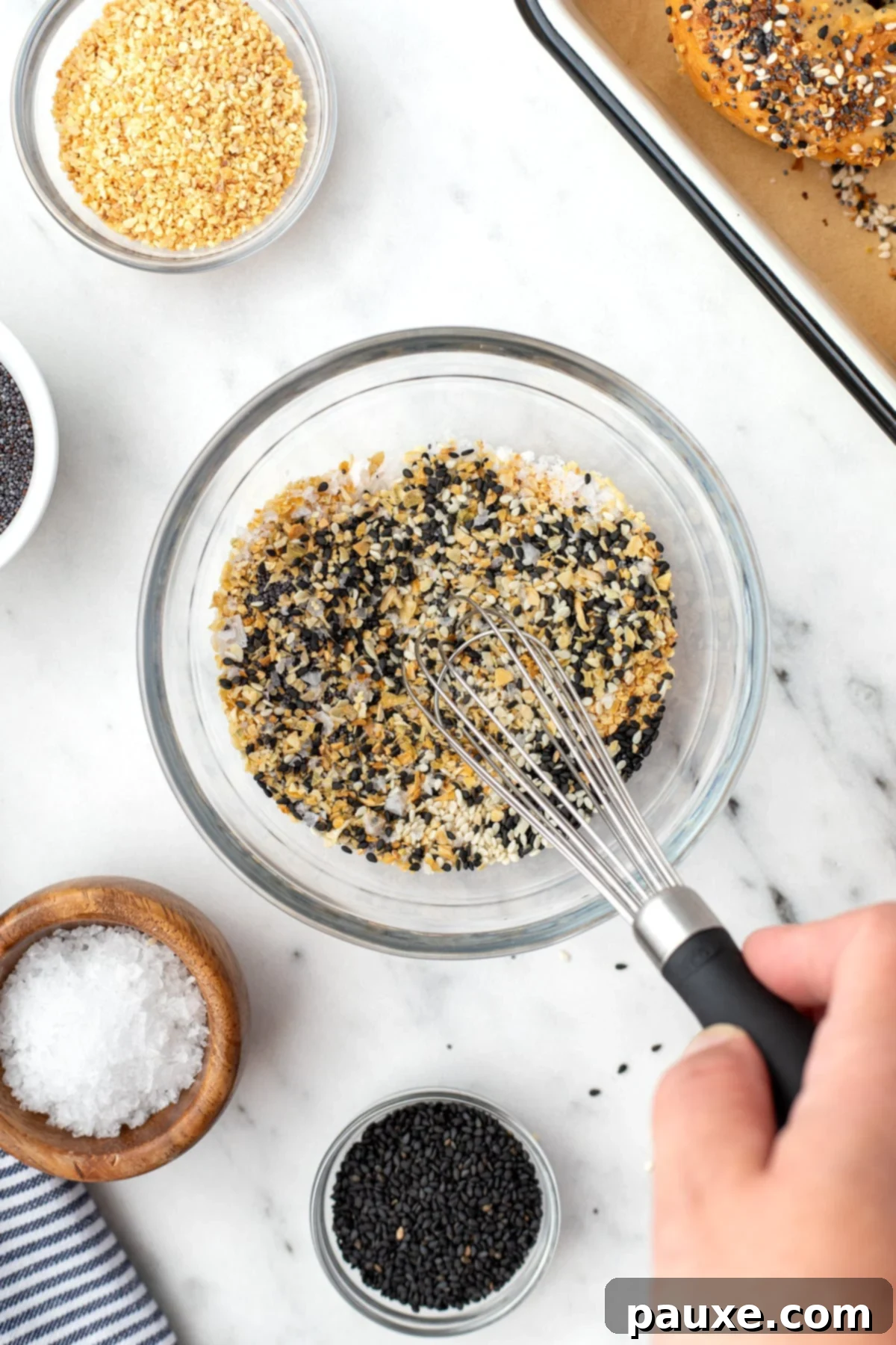 The Ultimate Seed & Spice Blend 5 A small bowl of seeds and seasonings being mixed together with a small whisk.