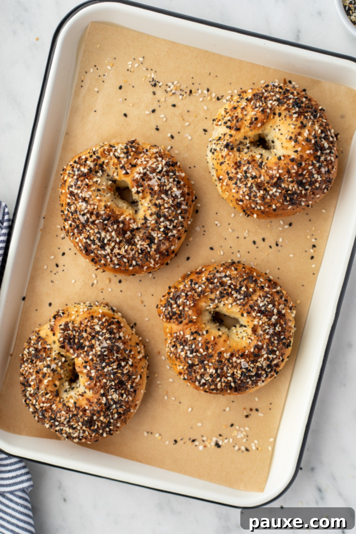 The Ultimate Seed & Spice Blend 7 A baking tray with four everything bagels laid out.