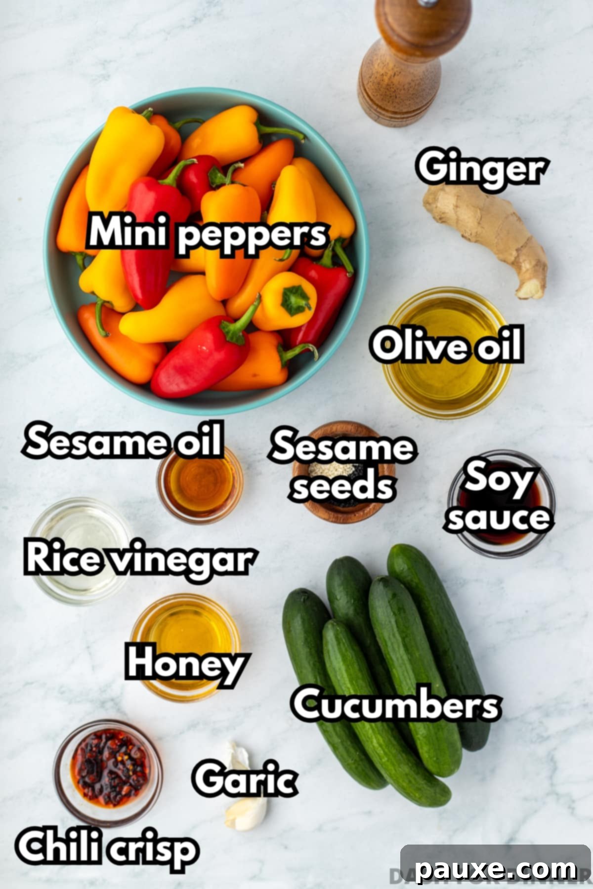 A bowl of mini peppers, mini cucumbers, and the ingredients to make a ginger sesame dressing.