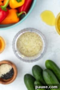 Grated garlic mellowing in a small amount of rice vinegar.