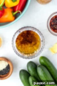 A mini blender filled with ingredients needed to make vinaigrette.