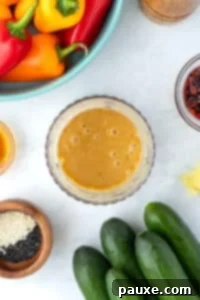 A small blender cup filled with ginger sesame dressing.