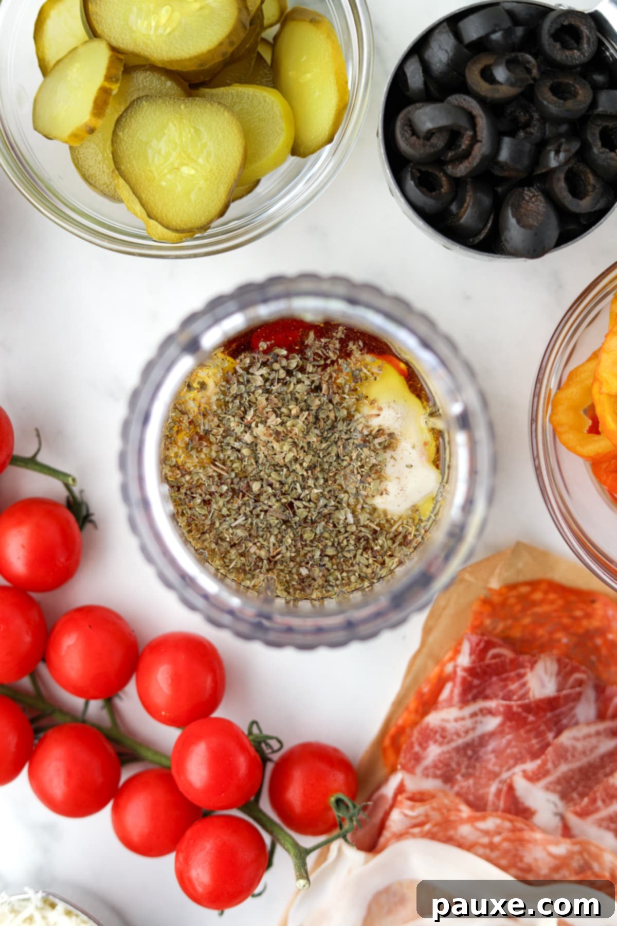 The Sub Secret 4 A small jar blender filled with olive oil, oregano, red wine vinegar, and other dressing ingredients.