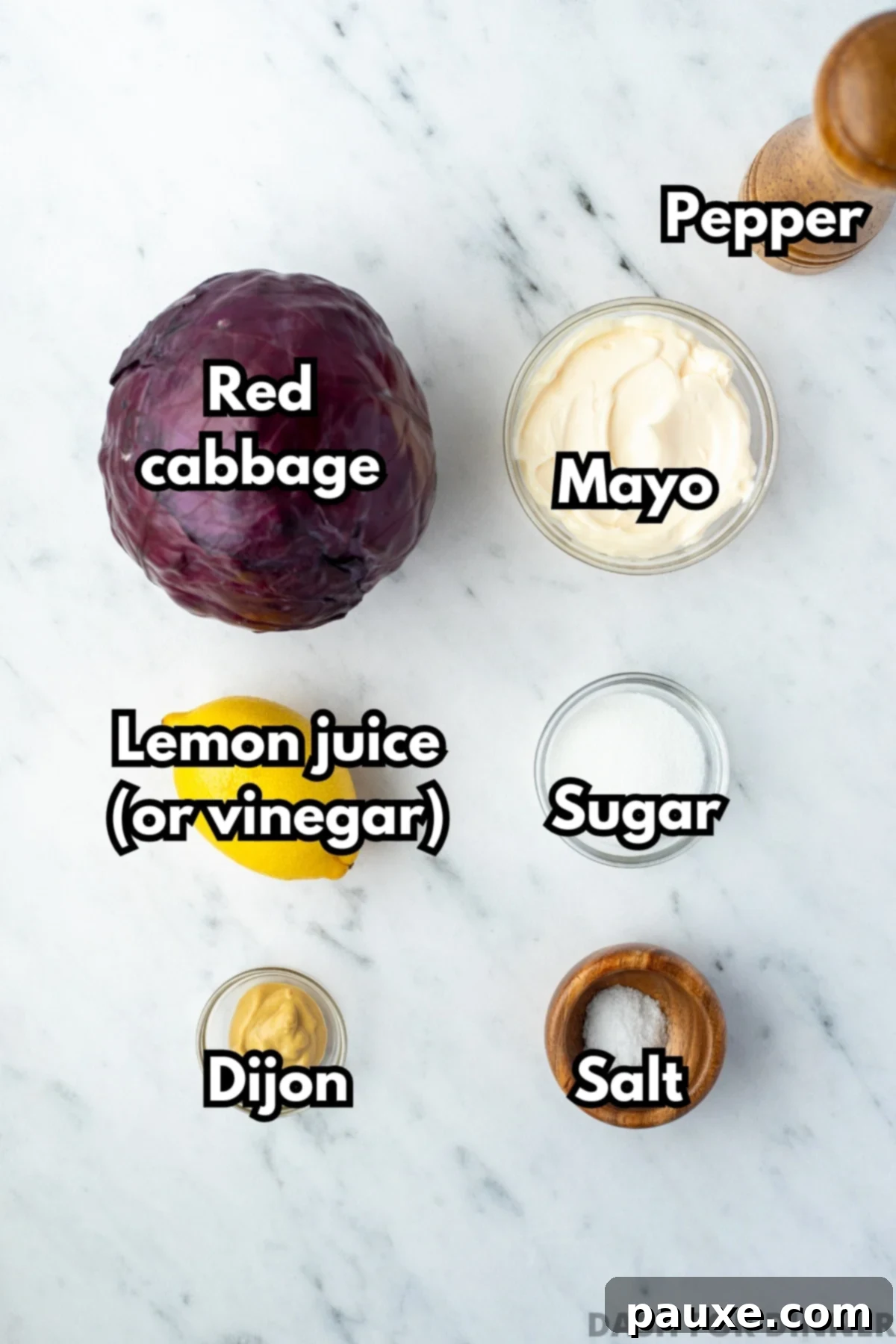 Fresh Israeli Cabbage Slaw 3 A vibrant head of red cabbage, alongside a bowl of mayonnaise, a fresh lemon, sugar, Dijon mustard, and salt, showcasing the simple ingredients for the salad.