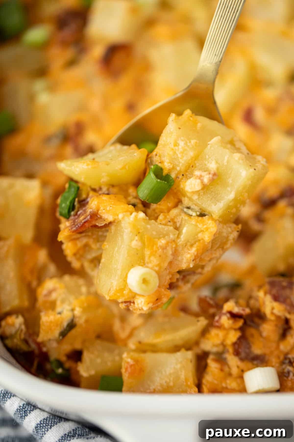 Deep South Midnight Spuds 8 A spoonful of baked potato casserole dotted with green onion, cheese, and bacon.