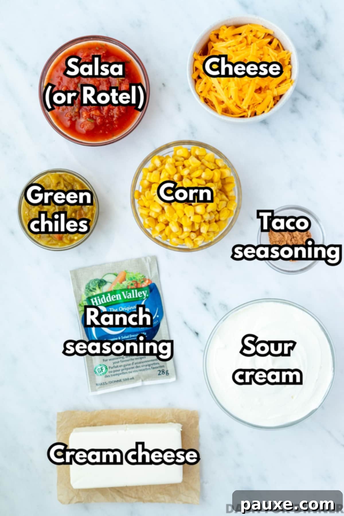 The ingredients needed to make boat dip, including cream cheese, sour cream, cheddar cheese, and ranch seasoning.