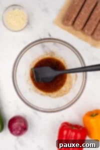 Air-Fried Chicken Sausage & Roasted Veggies 11 A bowl of oil and seasonings mixed together.