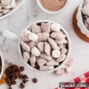 A mug of muddy buddies, dotted with random mini marshmallows.
