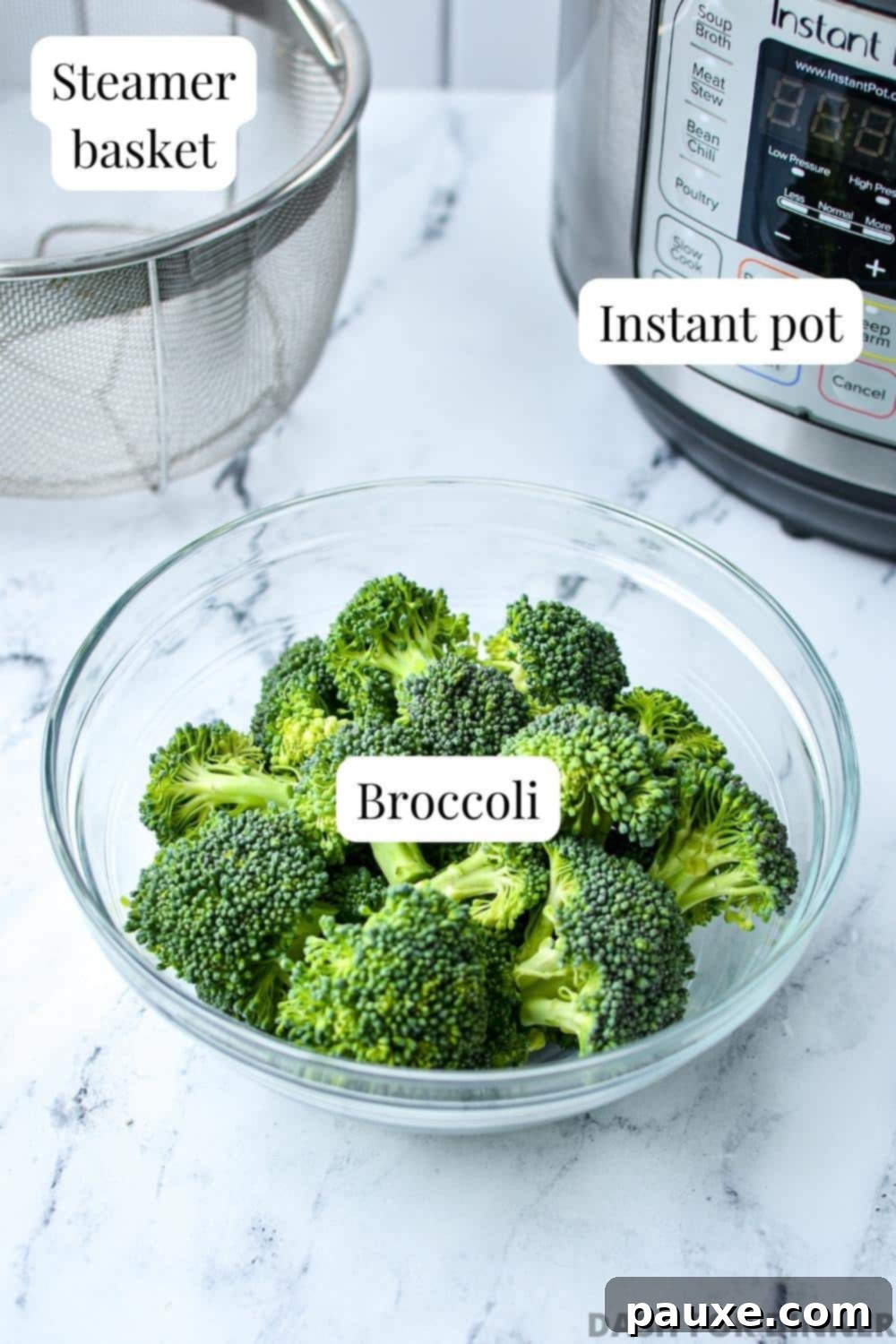 Effortless Instant Pot Broccoli 3 A bowl of fresh broccoli florets sits next to a metal steamer basket, with an Instant Pot in the background, ready for cooking.