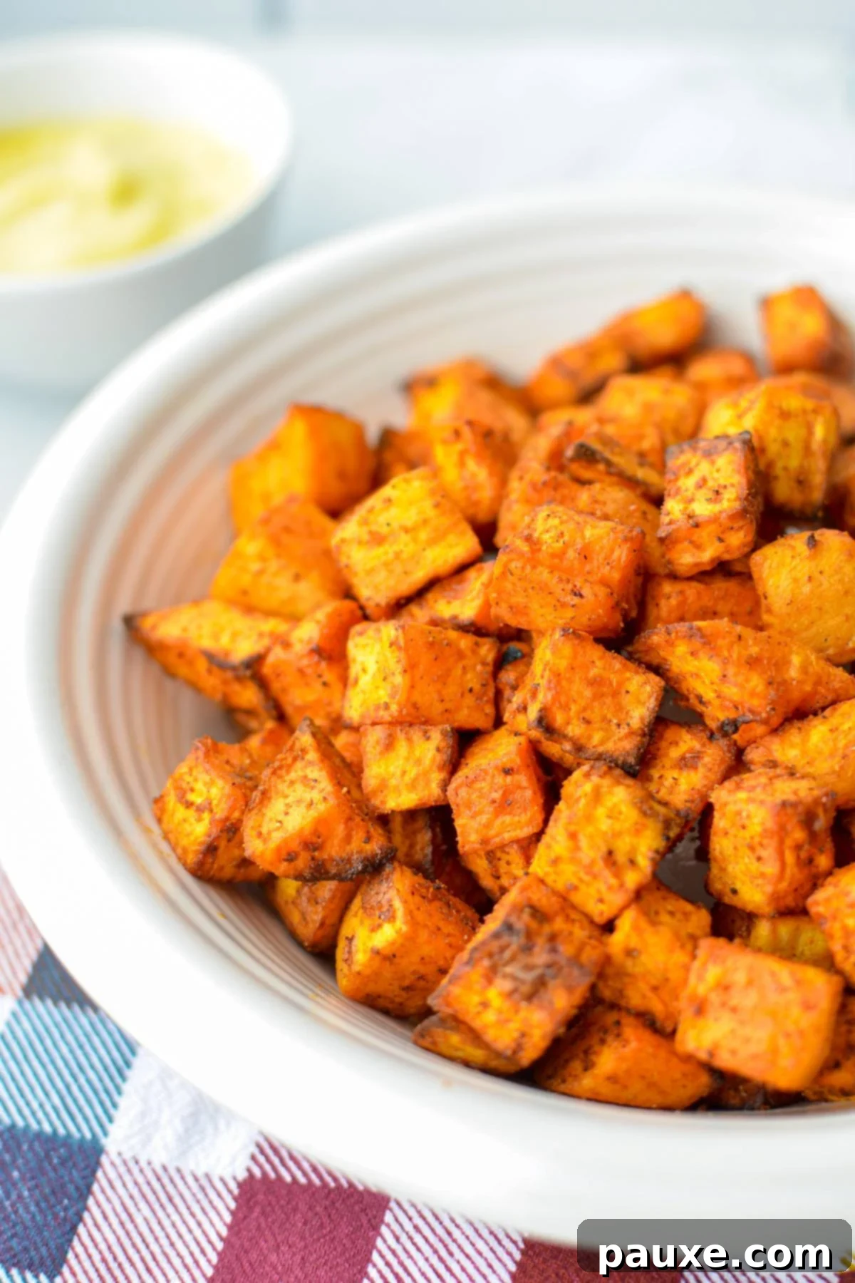 Crispy Air Fryer Sweet Potato Cubes 2 A bowl of golden, crispy air fried sweet potato cubes, perfectly seasoned and ready to enjoy.