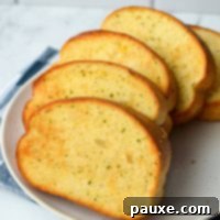 Crispy Air Fryer Texas Garlic Toast 11 A plate of frozen garlic toast, cooked to perfection, golden and ready to eat.